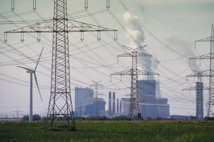 Oil and gas platform at dusk with industrial structures silhouetted